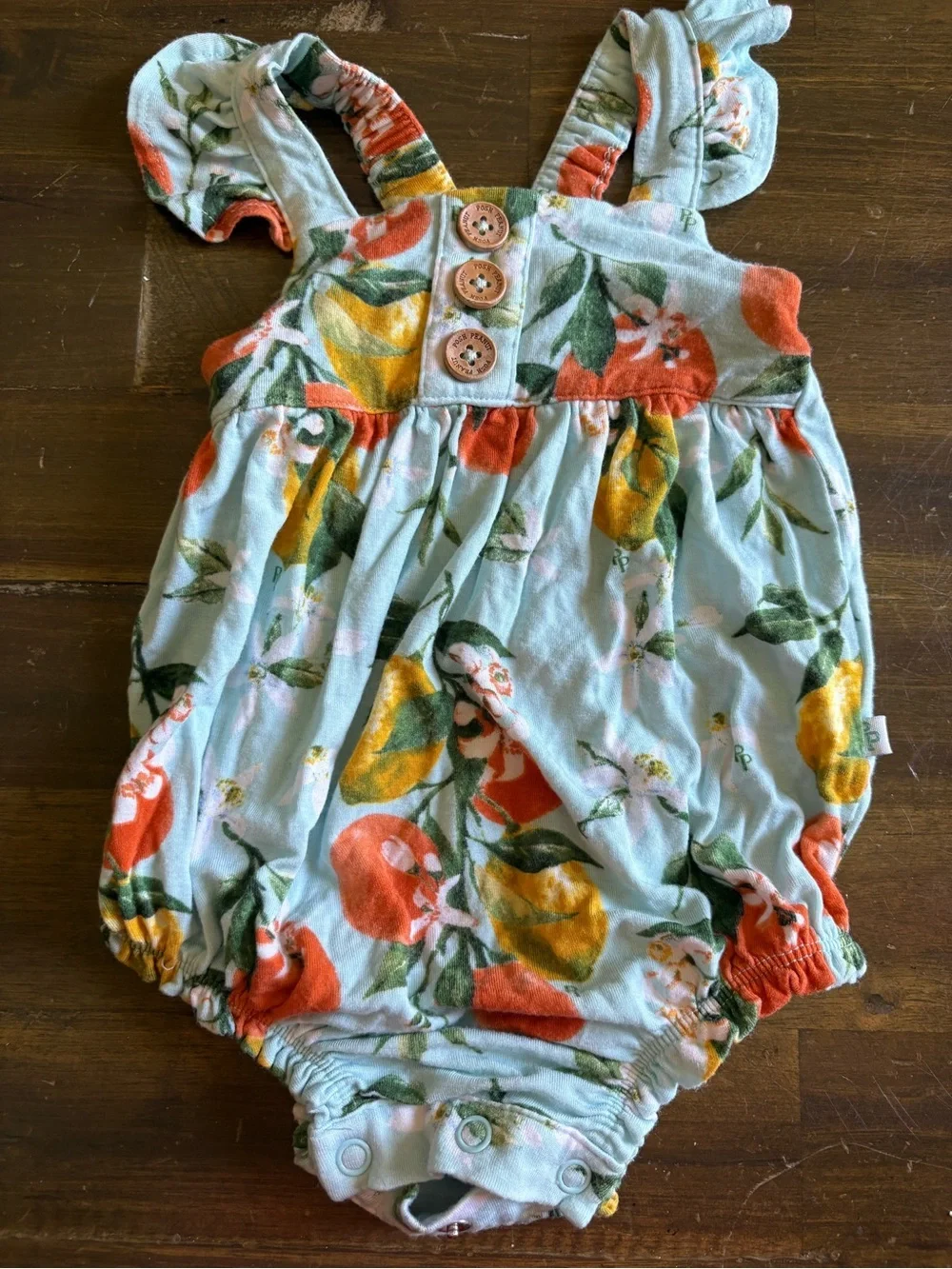 Posh Peanut Mirabella Henley Ruffled Capsleeve Bubble Romper Citrus Print Orange